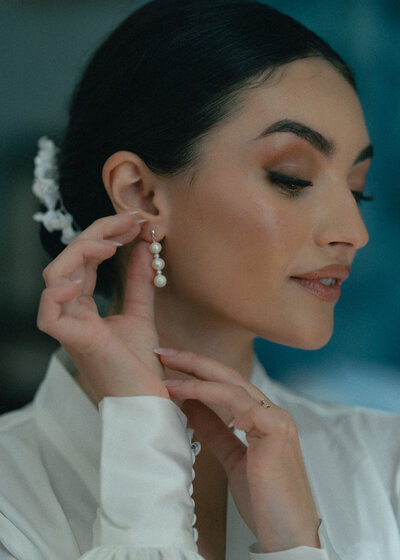 Modern bride posing with poise and elegance, her wedding gown highlighting her unique sense of style in a breathtaking backdrop