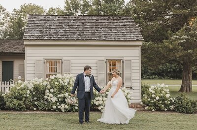 Wedding Photographer & Elopement Photographer Husband and wife kiss outside of summer springs venue