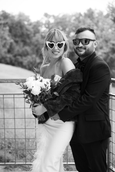 A black and white photo of a bride and groom posing for a photo taken by an Austin wedding photographer.