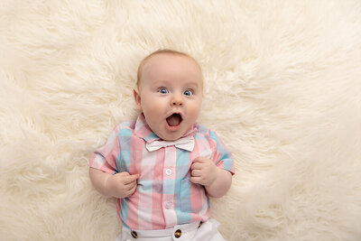 baby boy in plaid shirt by Philadelphia Newborn Photographer