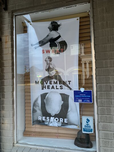 photo of sign outside of a yoga studio branding