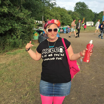 Woman dressed colourfully at Glastonbury festival