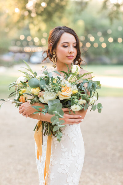 Bride holding bouquet at Rancho Robles Wedding Venue