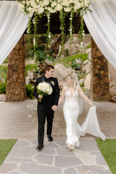 Romantic bride and groom photos at the pala mesa resort with the ceremony as the backdrop