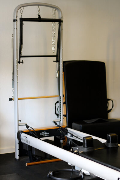 Pilates Tower workout with spring resistance for full-body control