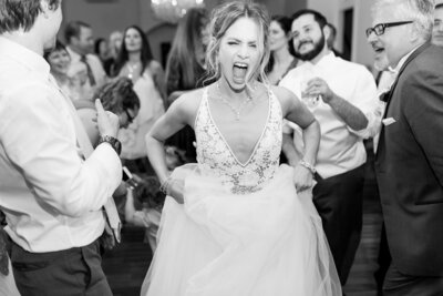 Fun playful wedding reception photo by top Orlando wedding photographer