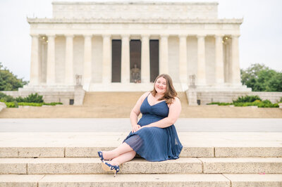 Law school grad sits on the steps of the Lincoln Memorial during graduation session photographed by Baltimore Graduation Photographer Cait Kramer
