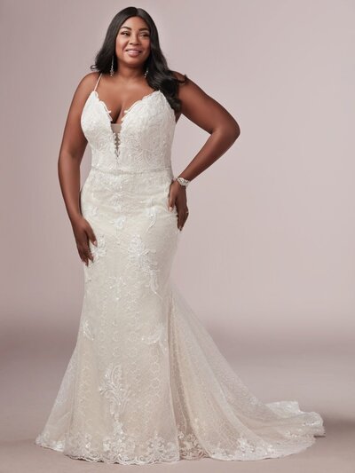 A romantic off-shoulder neckline and beautifully ornate appliques are the focal points of thie ballgown.
