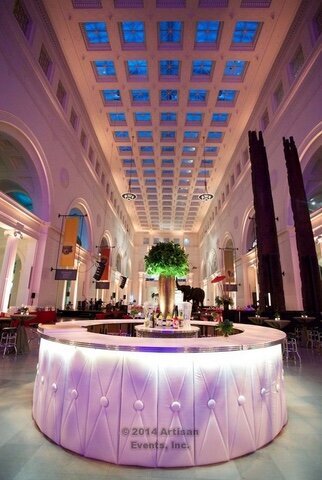 lobby of event space with lighting and floral decor