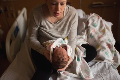 Mother admiring baby hours after birth during  Fresh 48 session at Swedish Issaquah hospital