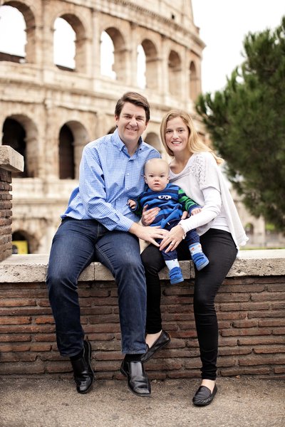Family sitting in front of the Colosseum. Taken by Rome Family Photographer, Tricia Anne Photography