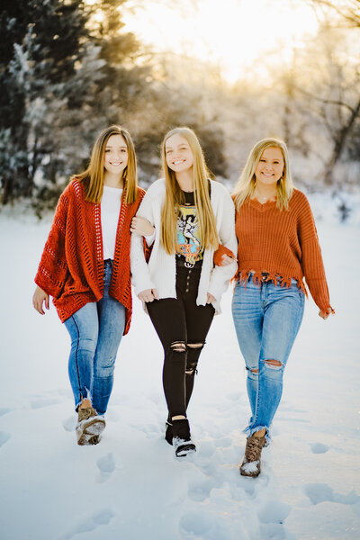 high school girls walking in the snow in rural nebraska