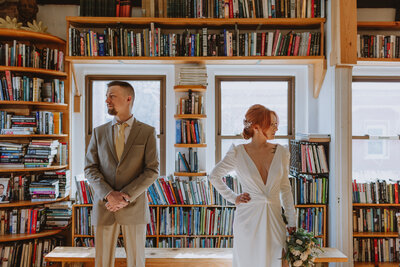 bride and groom in a book store
