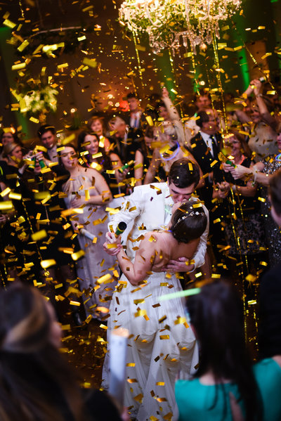 Couple celebrate under confetti at the Ivy in Flowood Mississippi
