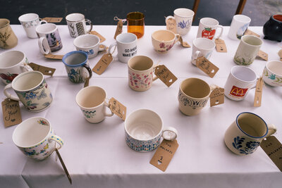 Wedding tea table featuring mismatched vintage teacups and saucers – photographed by wedding photographer Niko Coric – Lumen Clarity Media