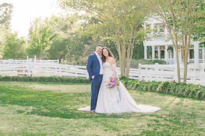 A newly married husband and wife leaving their estate wedding venue at sunset by JoLynn Photography, a Raleigh wedding photographer