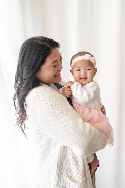 Family session of mother and daughter wearing a pink dress