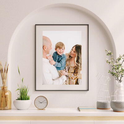 framed family photo on mantel during Branson MO family photography session