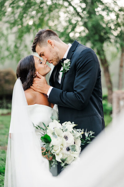 bride and groom under veil by Knoxville Wedding Photographer, Amanda May Photos