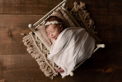 Adorable newborn baby sleeping during a portrait session in Paris, Ontario