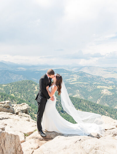 A couple kisses on top of Lost Gulch Lookout in Boulder during their Rocky Mountain elopement.