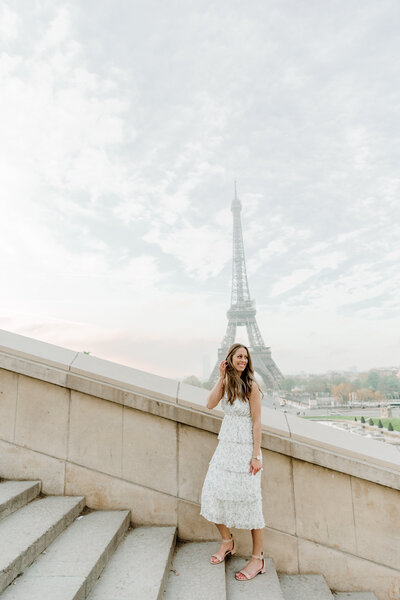 Danielle in France with the Eiffel Tower in the background