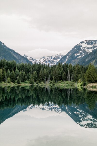 Photo of mountains reflecting in a lake at Gold Creek Pond in Washington