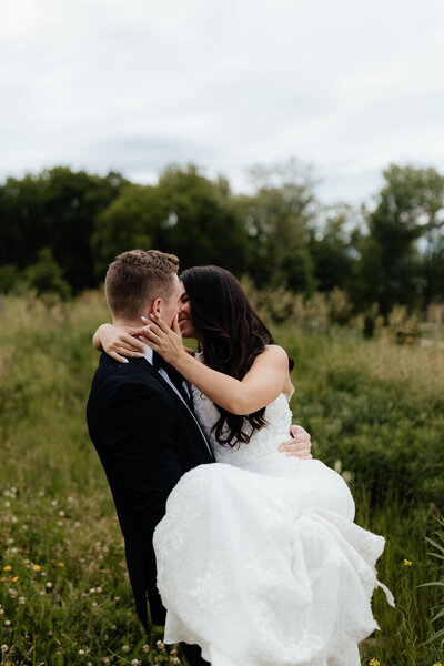 Bride and groom share a romantic moment together just after they say "I do" in the Finger Lakes.