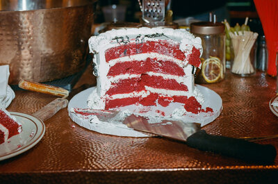 The inside of a layered red velvet cake.