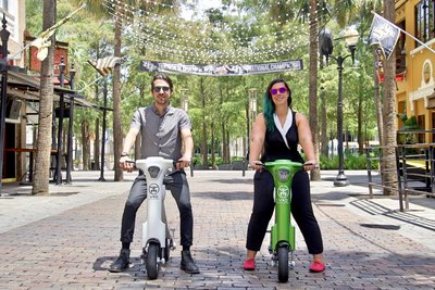 Friends taking E-Bike tour around Central Florida on there Green & White Go-Bike M1