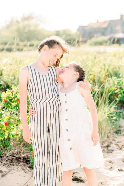 Sisters sharing a laugh during Brant Point photo session