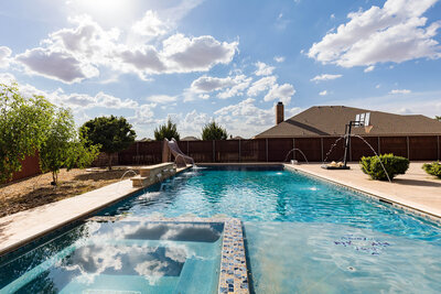 Backyard pool real estate photo in Southwest Lubbock TX