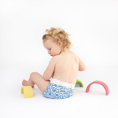 Toddler sitting for a photo during a baby photoshoot in Hobart by Lauren Vanier Photography