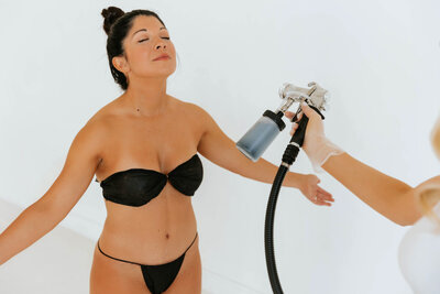Experience the precision and attention to detail of our airbrush tanning technique at Tan Artistry Plano