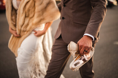 Lifestyle shot with motion of bride and groom walking