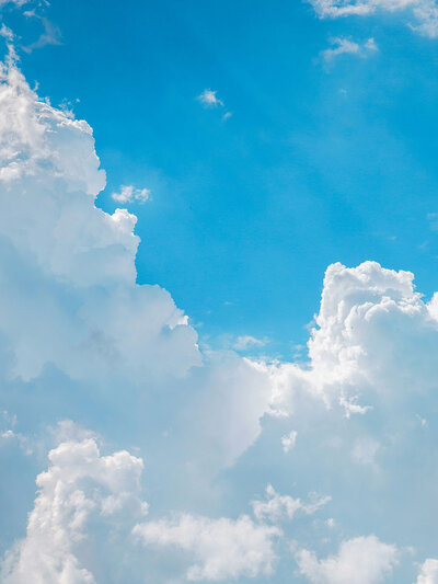 Stock image of a blue sky with clouds. 