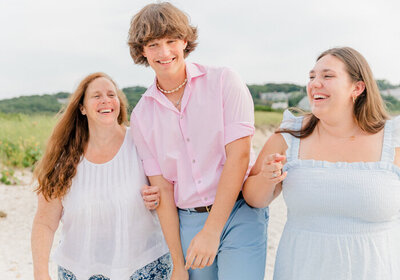 Close up of mother and two teenagers laughing together in Falmouth, MA