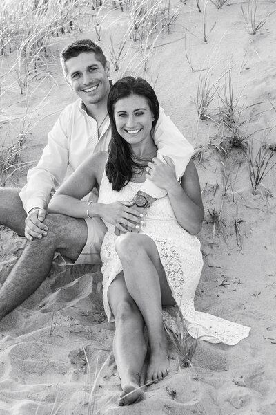 Couple Posing Next To Sand Dune
