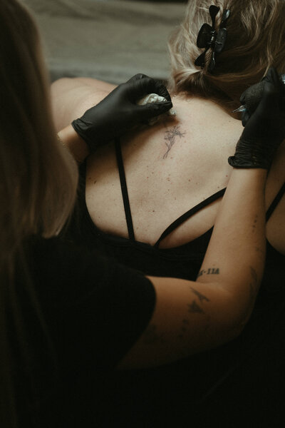 Signature fine-line style from a Pittsburgh tattoo artist known for elevated, minimalist ink.