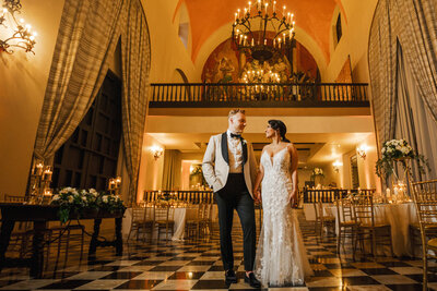 Bride and groom pose in Salón Campeche at El Convento hotel, Puerto Rico