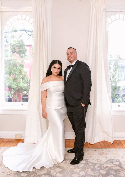 Bride and Groom posing for portraits at the 718 Venue in Fredericksburg, Virginia. Taken by Bethany Aubre Photography.