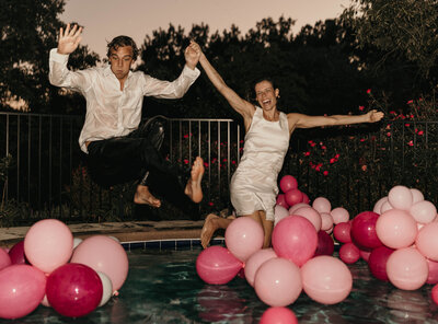 wedding couple jumping into pool