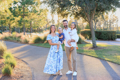 Family of four pose along the bike trails of the beautiful Starkey Ranch neighborhood in Odessa, Fl.