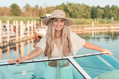Nautical inspired senior pictures on a boat