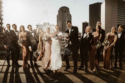 St Louis skyline wedding champagne pop