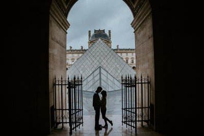 Couple on their multi day elopement in Paris France at the Louvre