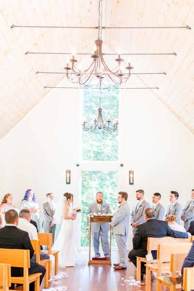 A photo of a couple's wedding ceremony at Juliette Chapel in Dahlonega Georgia by Jennifer Marie Studios.