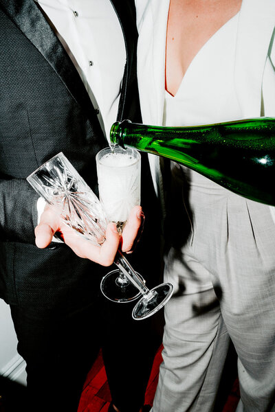 champagne flutes and tuxedo
