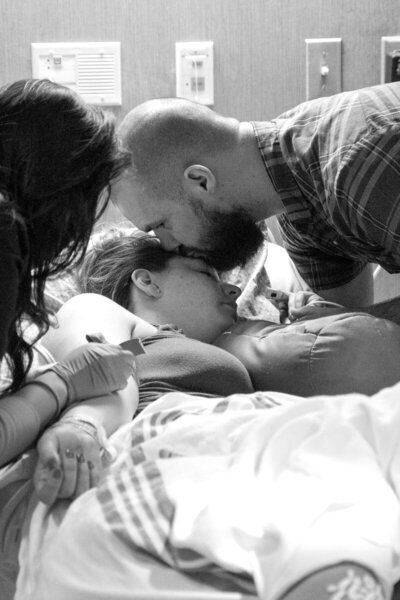 Dad kisses mom on forehead during labor at OU Children's Hospital.