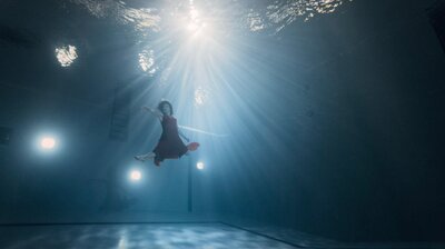 Woman underwater poses elegantly